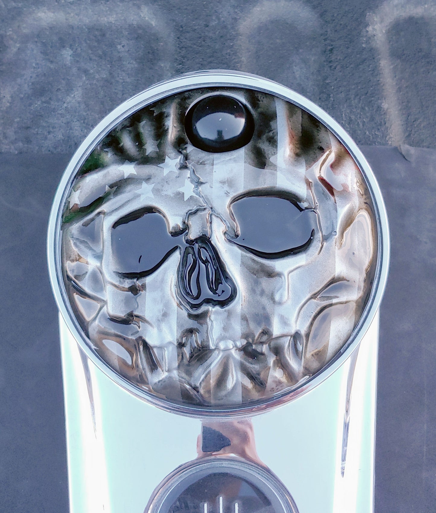 American flag stretch through a realistic skull on Harley touring fuel door
