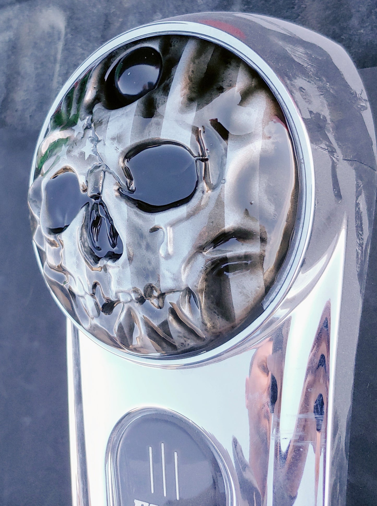 American flag stretch through a realistic skull on Harley touring fuel door
