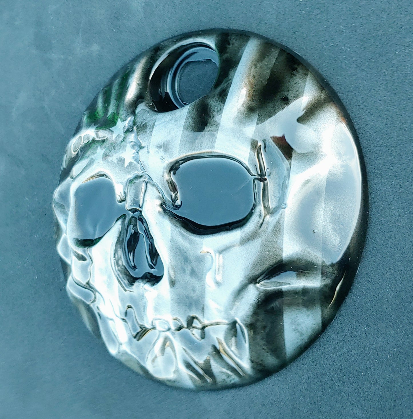 American flag stretch through a realistic skull on Harley touring fuel door