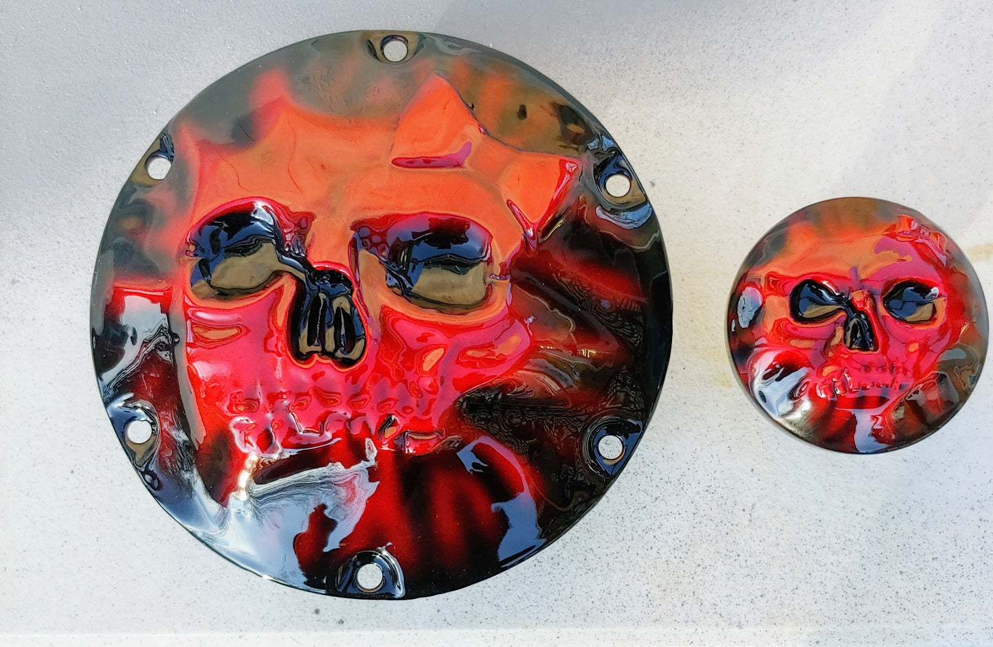 Skull and bow pushing through on Harley Davidson derby cover and fuel cap