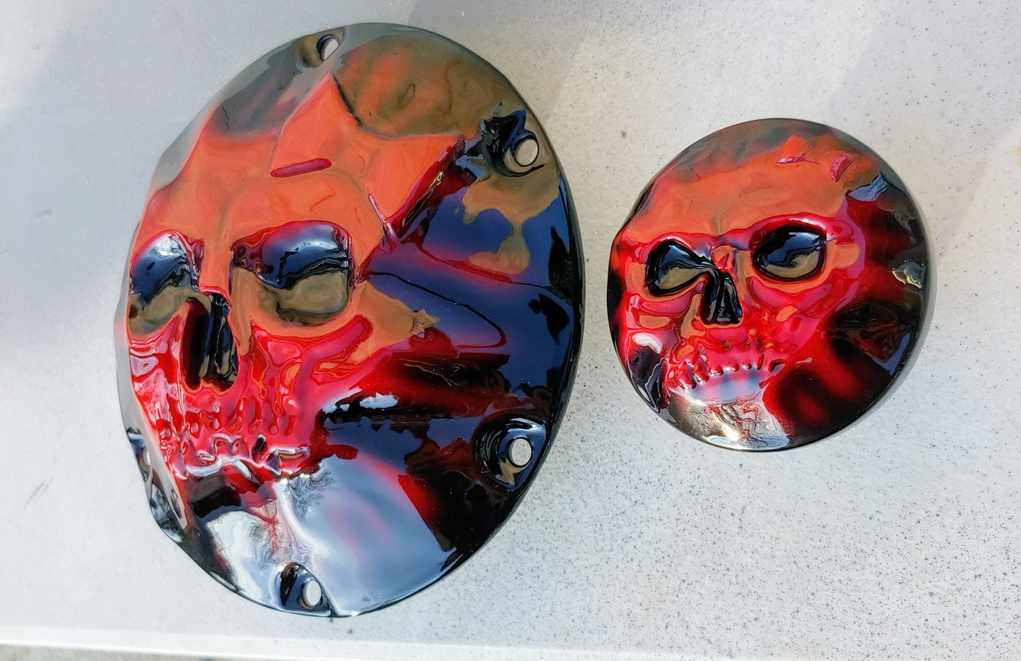 Skull and bow pushing through on Harley Davidson derby cover and fuel cap