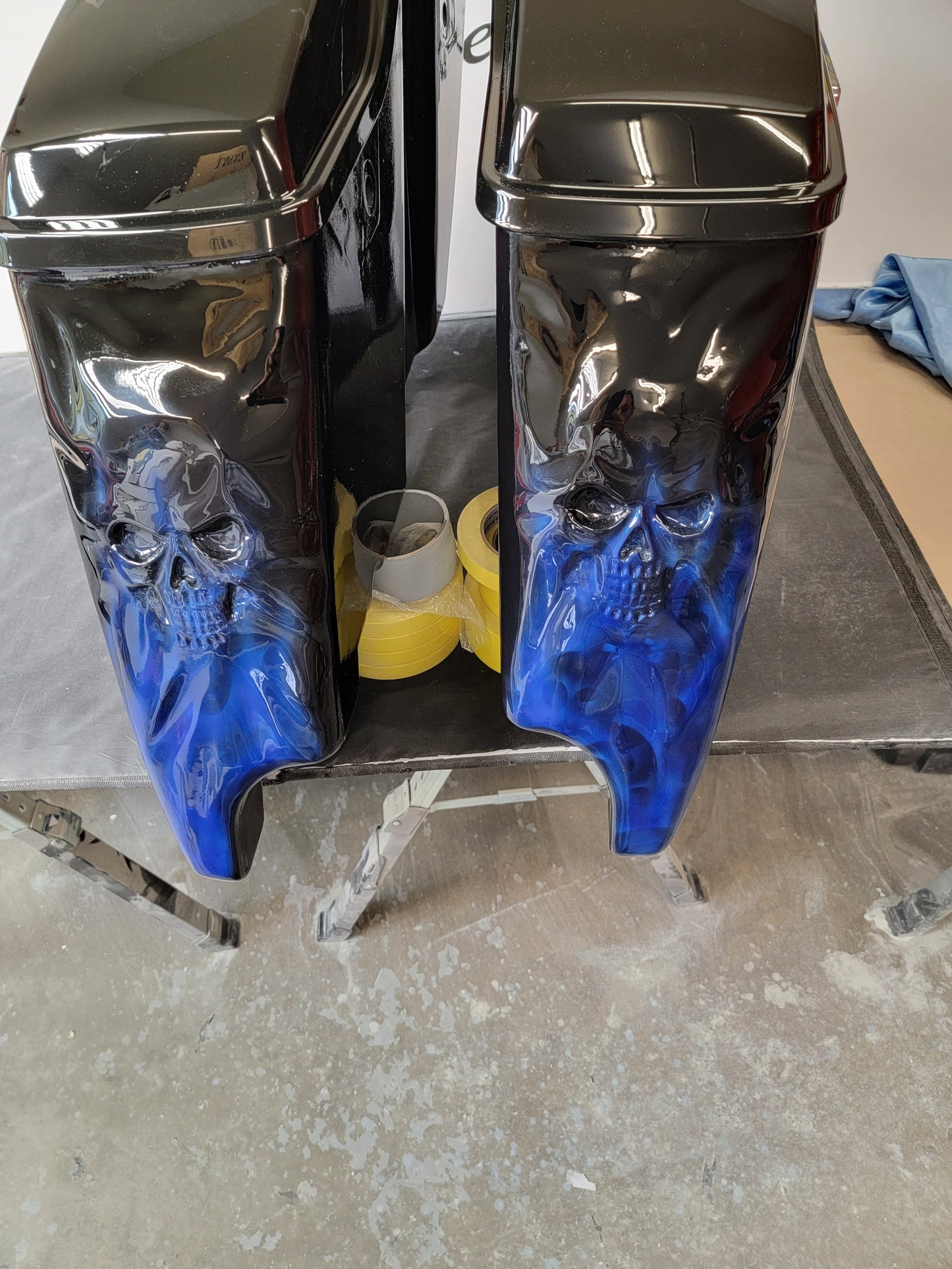 3D skulls stretching through stretched bags