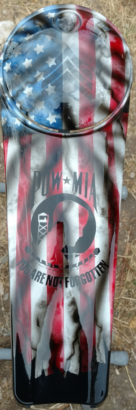 Harley Davidson POW-MIA tribute on a worn and tattered American flag console